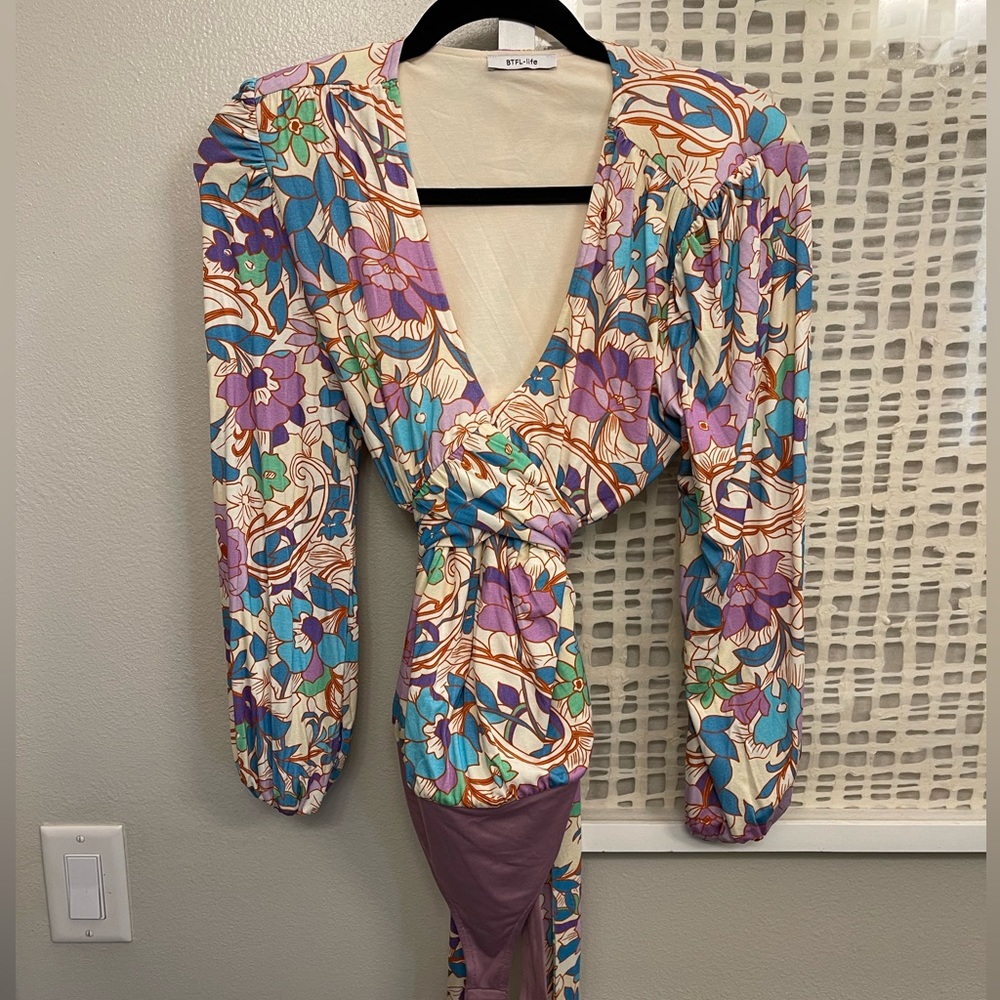 Long sleeve one piece body suit.